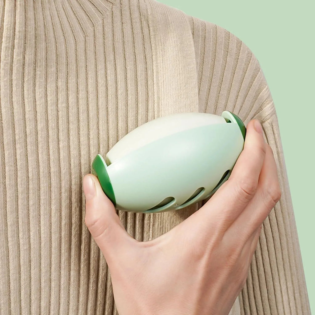 Green and white washable reusable gel lint roller ball for pet hair removal from fabrics