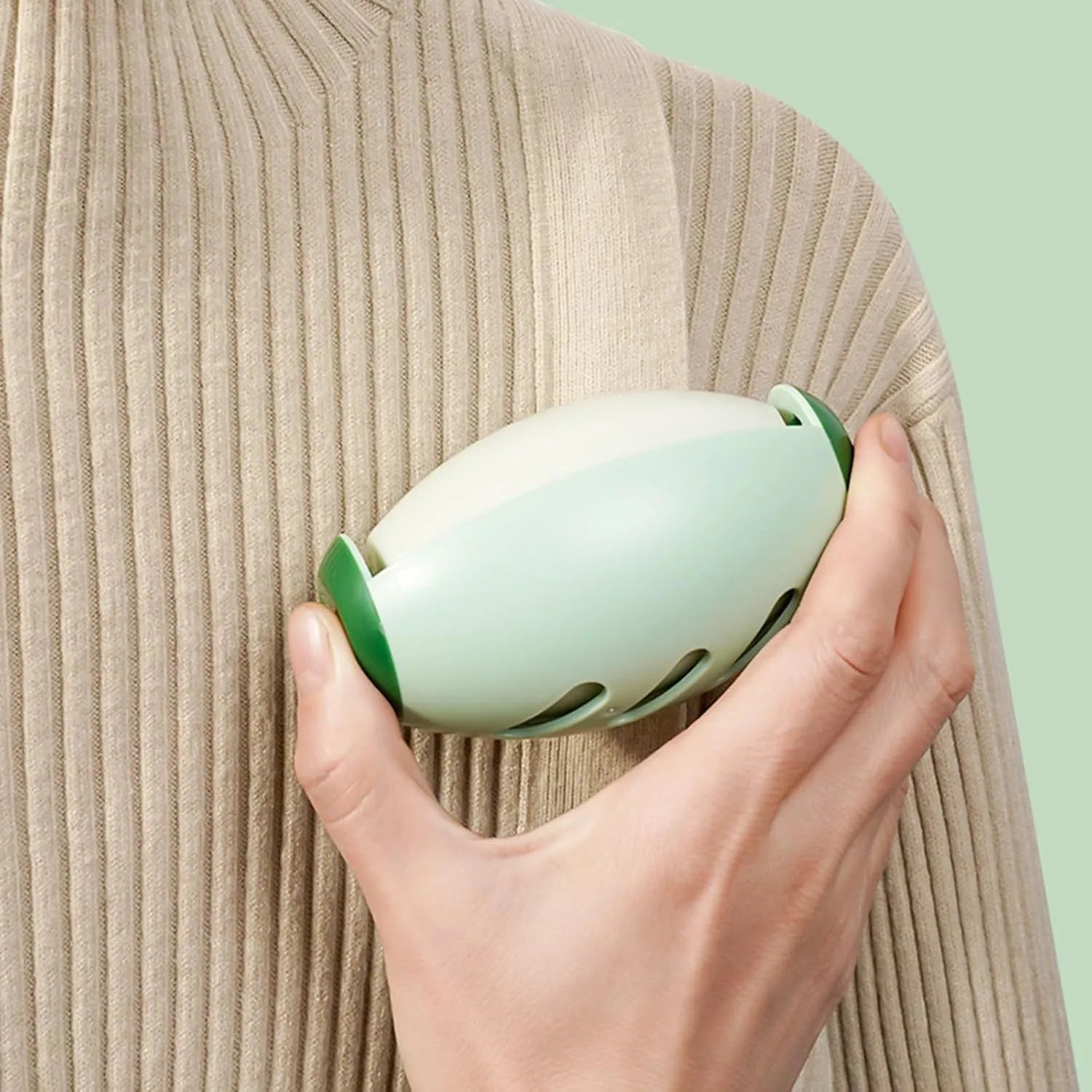 Green and white washable reusable gel lint roller ball for pet hair removal from fabrics