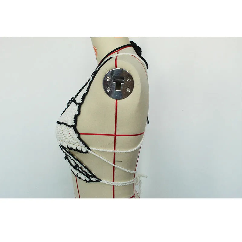 Black and white classic two-piece bikini swimsuit for women on a hanger.