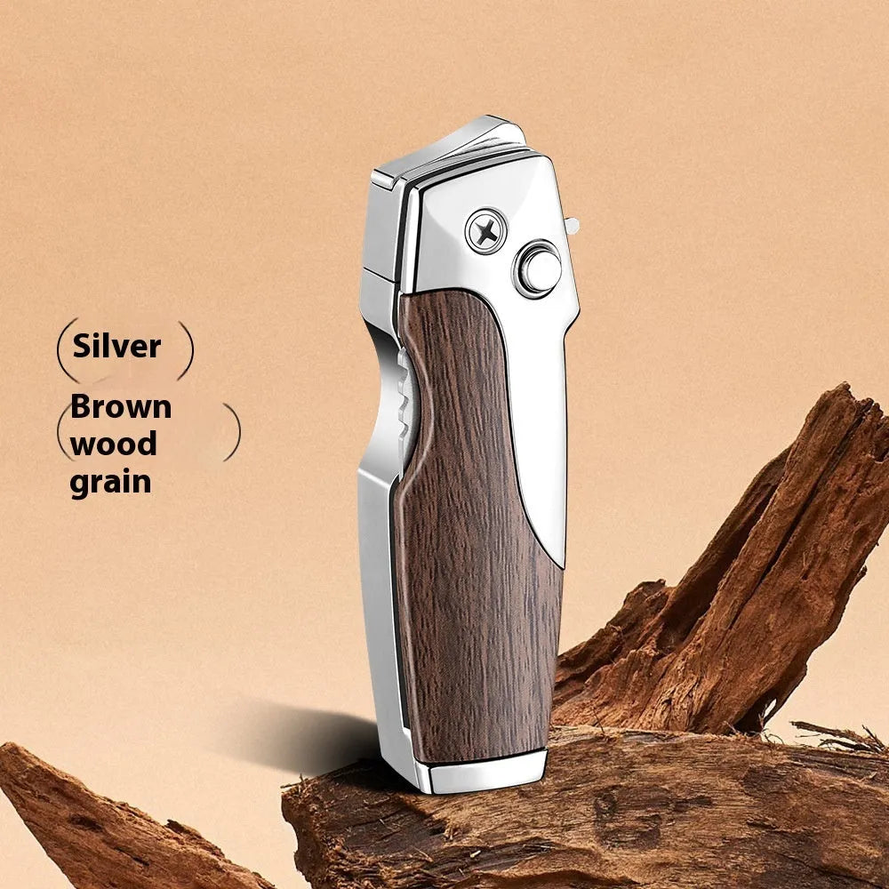 Zinc alloy folding lighter tool with integrated knife in a black wood grain finish.
