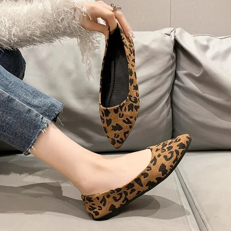 Women's leopard print flat pumps with pointed toe and low heel on rubber sole