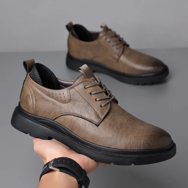 Men's black and brown cowhide leather sneaker shoes with rubber soles and decorative sewing lines.