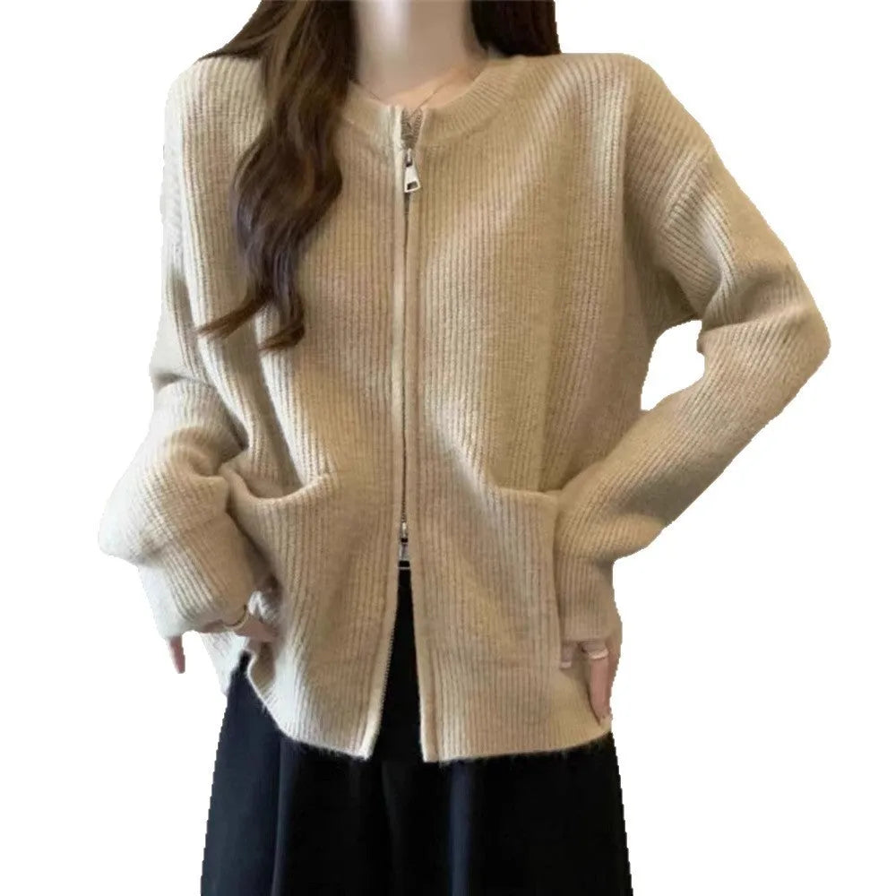 Beige soft viscose knit cardigan with long sleeves shown on a hanger.