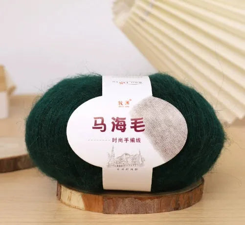DIY mohair scarf weaving kit showing one wool ball and a selection of 34 colour options including white, pink, blue and green.