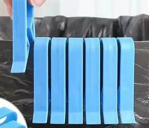 A white PP plastic clip designed to secure a bin bag to the side of a kitchen rubbish bin.