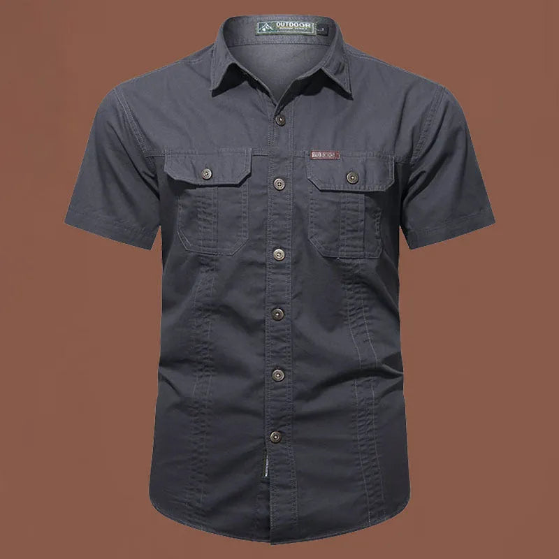 Men's loose fit cotton short sleeve work shirt in cardigan style on a hanger