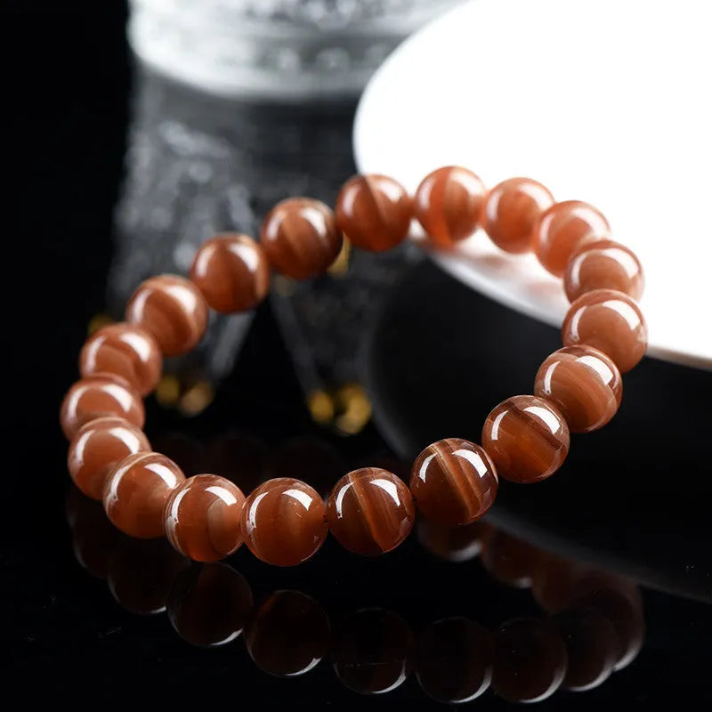 Natural Old Mine Rhodochrosite round beads bracelet from Peru with geometric design