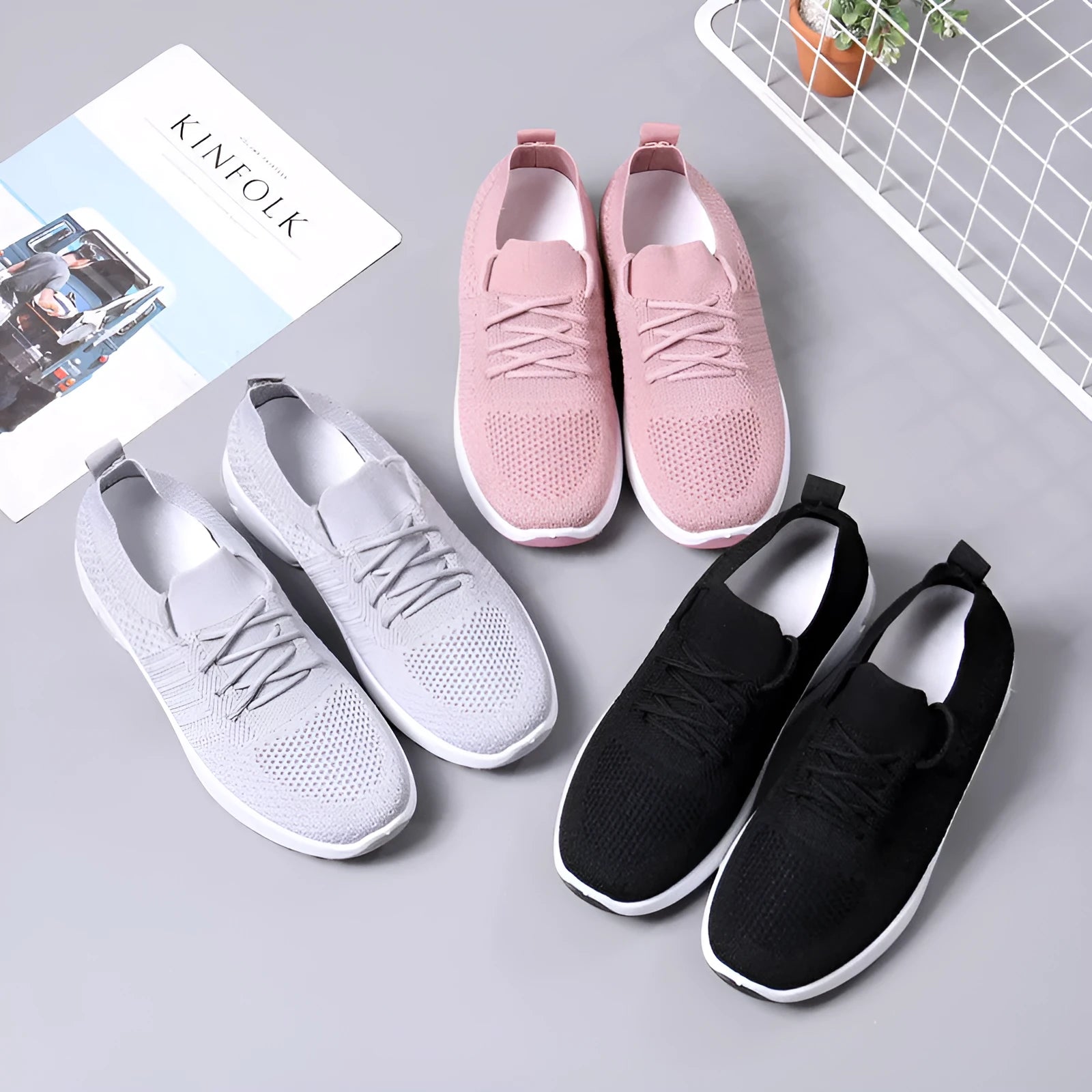 Women's black mesh casual sneaker with round toe and white non-slip PVC sole, shown from the side.