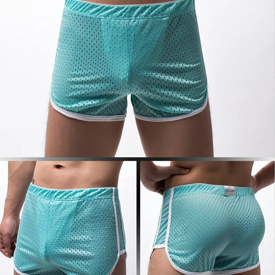 Men's black boxer shorts showing three-point ventilation panels and a mid-waist design.