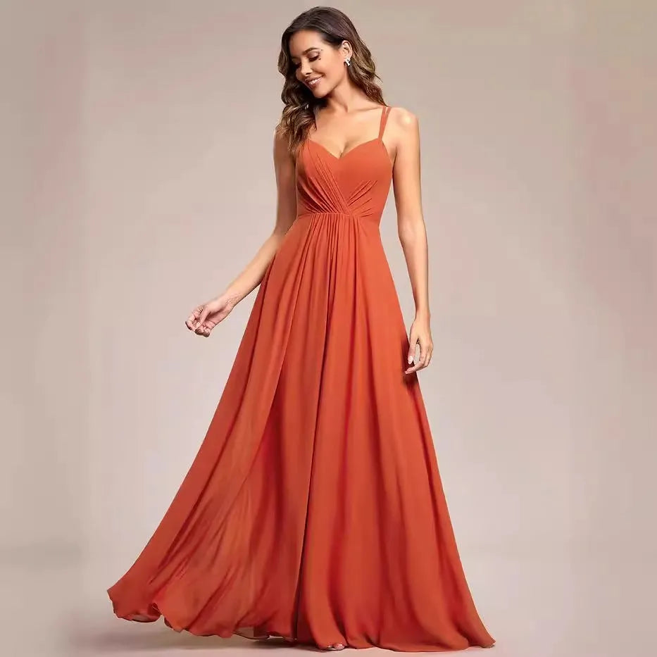 Women's long pleated sleeveless A-line dress in light green, shown on a mannequin.