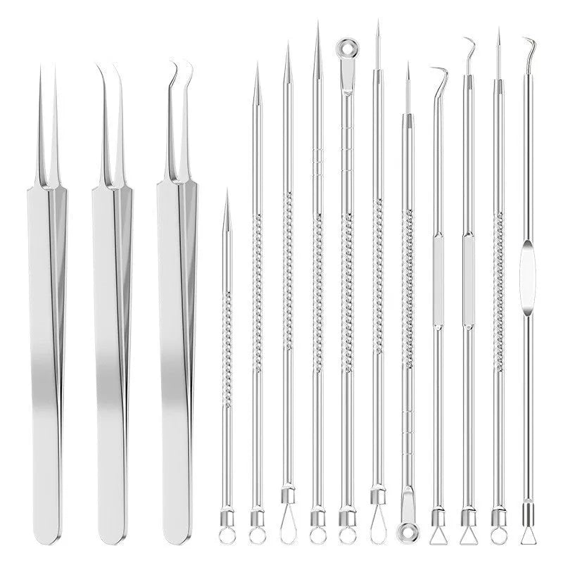 Four silver metal acne needles with pointed tips laid out on a flat surface.
