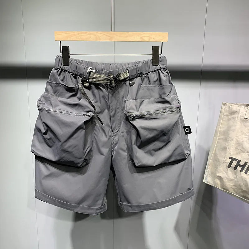 Men's black loose fitting work shorts with multiple pockets and straight leg hem