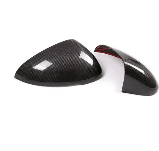 True carbon fibre rearview mirror cover for Porsche Macan, showing black woven pattern.