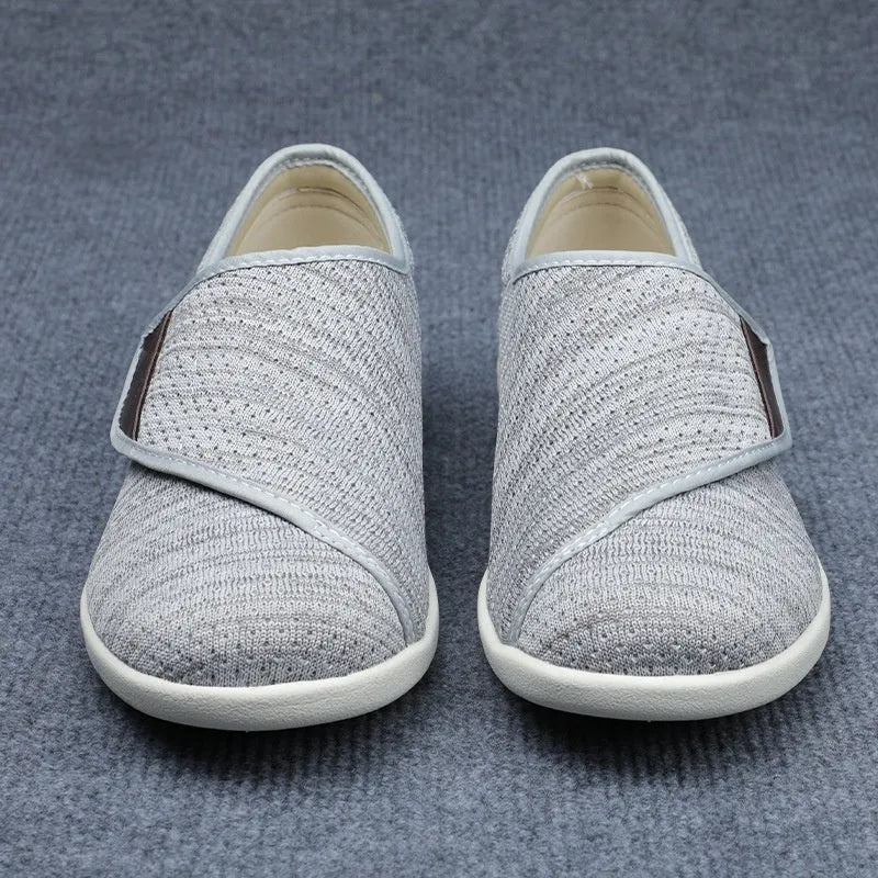 Casual beige slip-on shoes with a round toe and rubber sole for men and women.