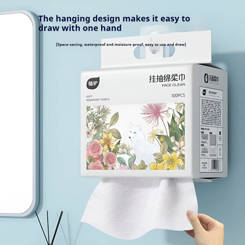 Roll of 100 disposable white face cloths on a hanging dispenser.