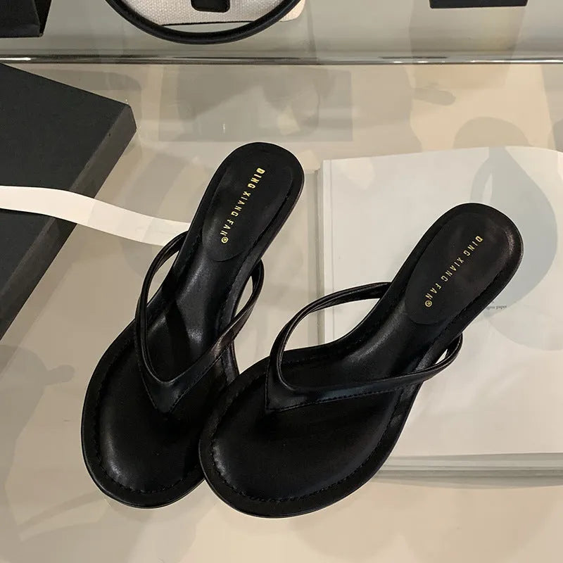 Women's black stiletto heel flip-flop sandals with round toe design