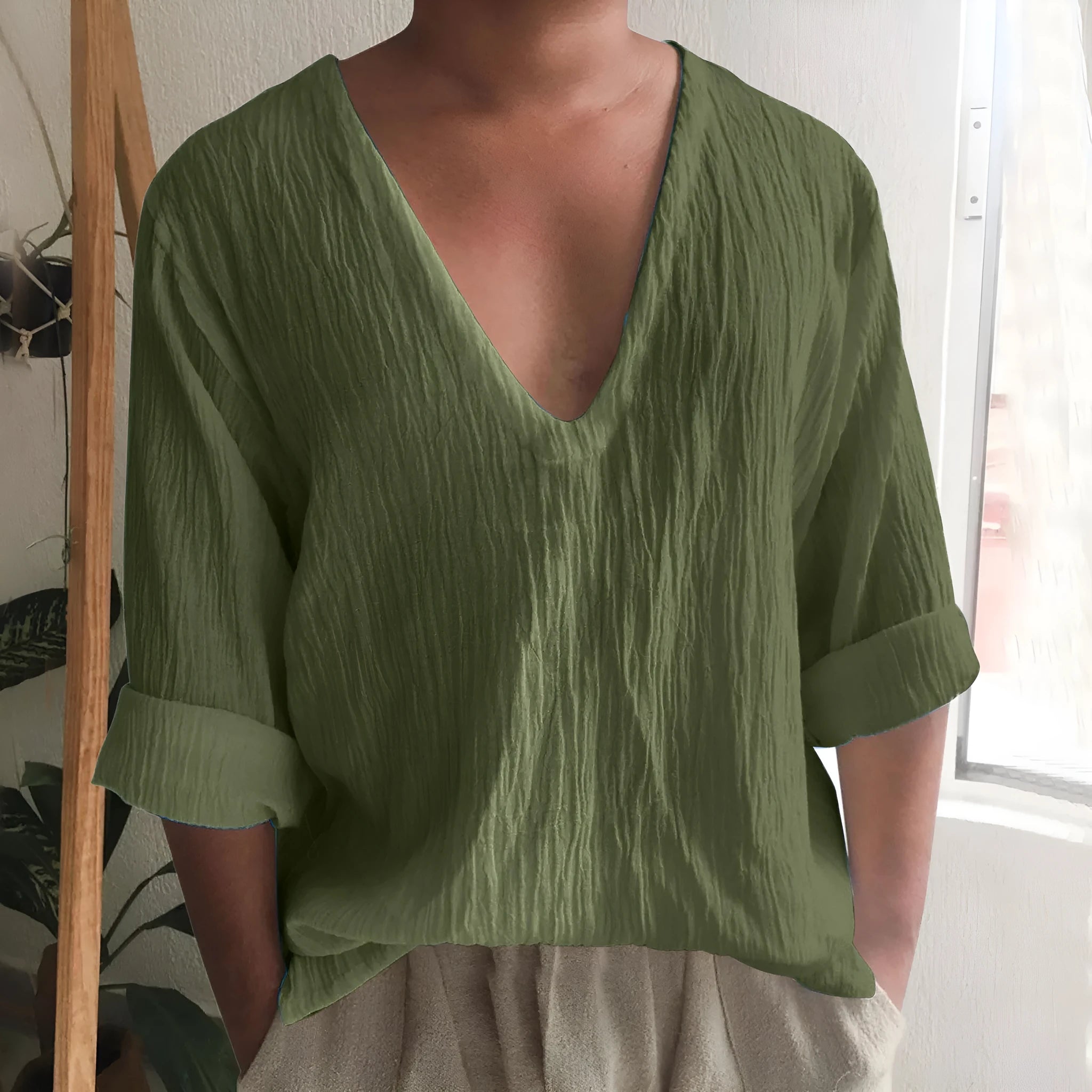 Men's washed cotton long sleeve V-neck t-shirt in solid colours on a hanger.