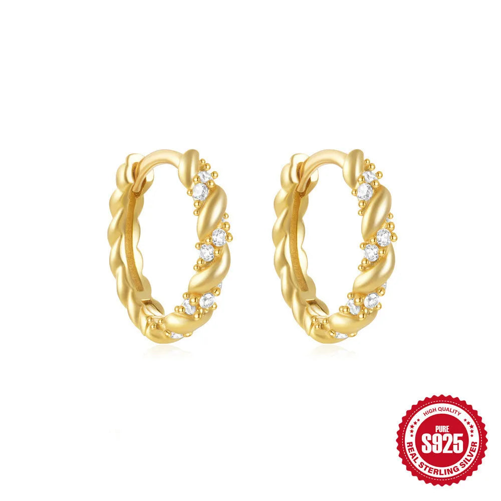 Small round geometric sterling silver stud earrings with a diamond shape, available in gold or silver finish.