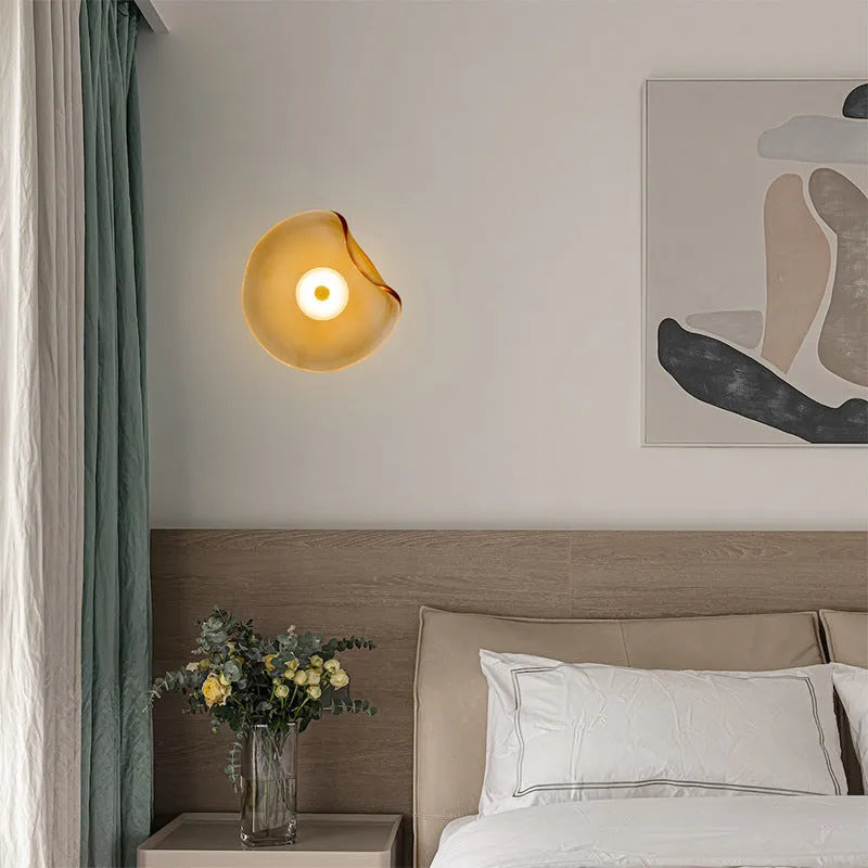 Round glass wall lamp in cognac colour with diffused lighting for bedroom bedside decoration