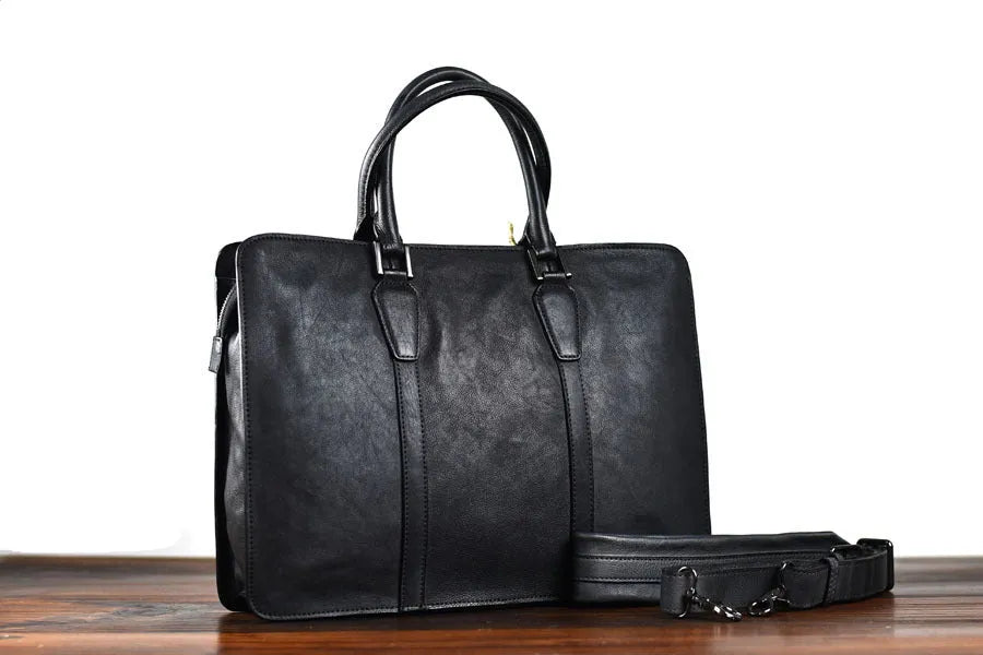 Men's brown leather business handbag with horizontal square shape and zipper opening