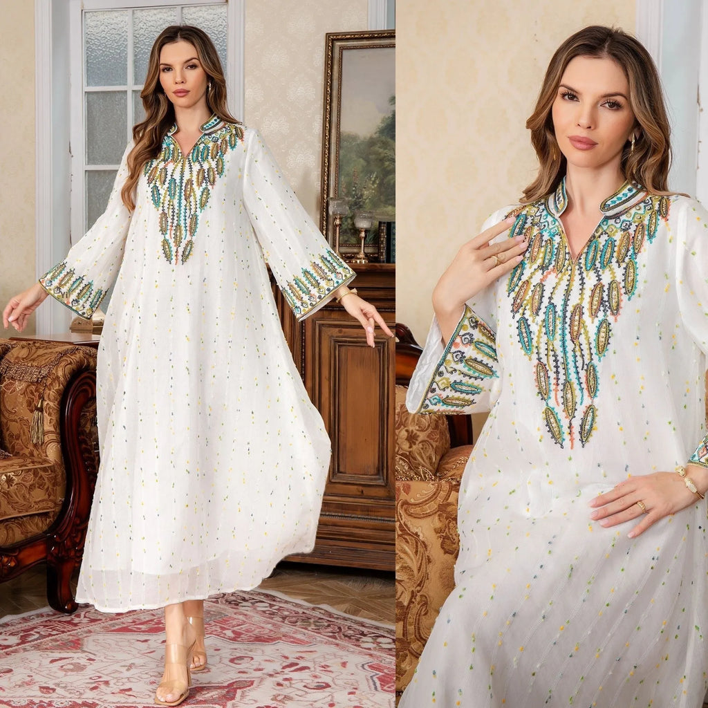 White long sleeve, long skirt Arabic robe for women on a hanger.