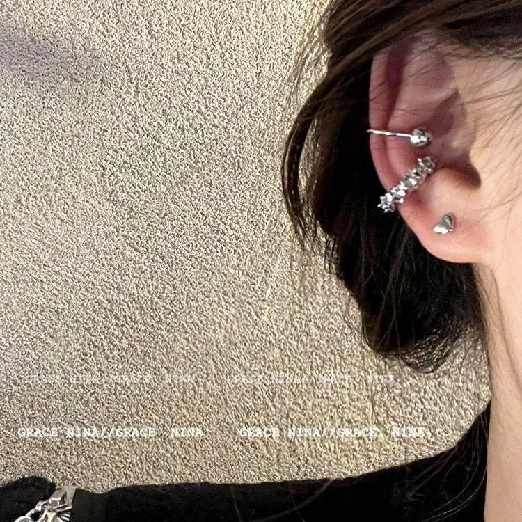 Geometric irregular shaped frosty finish alloy ear clip earrings with a double clip mechanism.