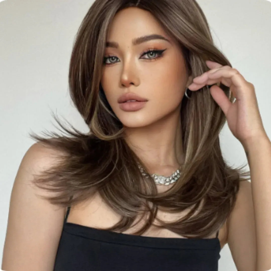 Mid-length platinum gradient colour wig with curly hair and fringe on model