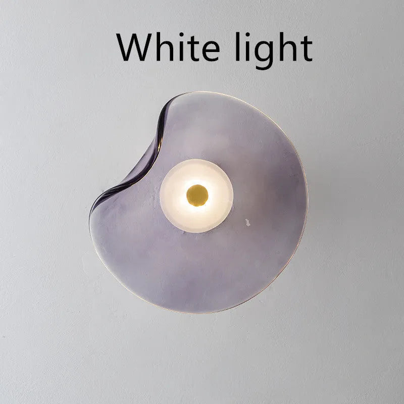 Round glass wall lamp in cognac colour with diffused lighting for bedroom bedside decoration