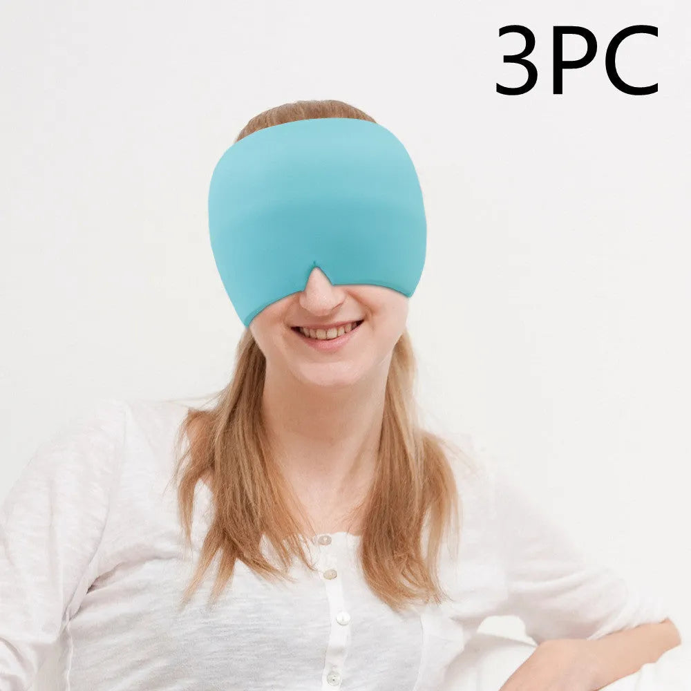 Black elastic cloth gel cold therapy eye mask for headache relief on grey background.