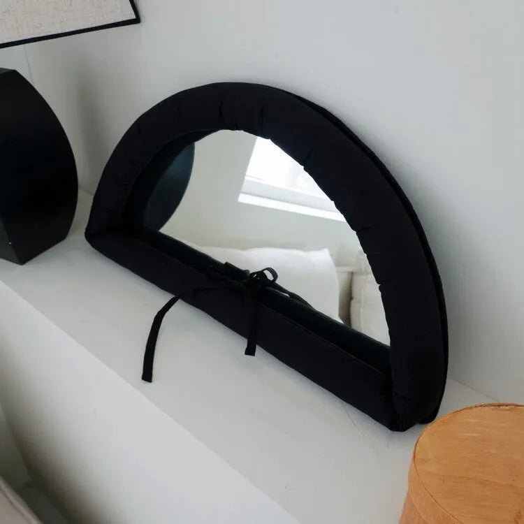Hanging cotton-filled fabric mirror in white, black or sapphire blue measuring 23x40x5cm