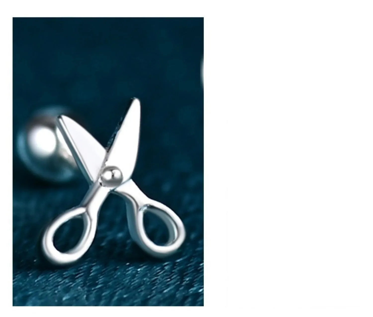 A pair of S999 pure silver screw-back ear studs featuring a decorative mini scissors design.