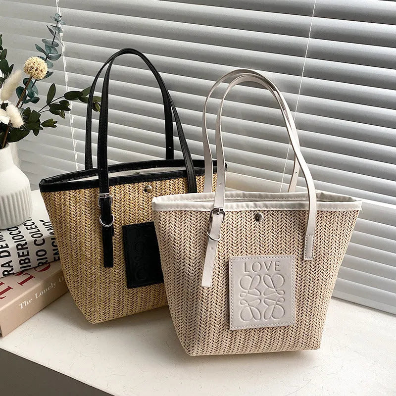 Straw woven women's shoulder bag with three-dimensional pockets in black colour option