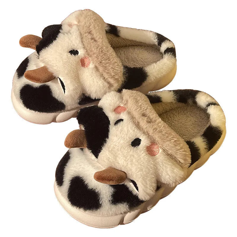 White cow design slippers with plush faux fur upper and textured non-slip sole