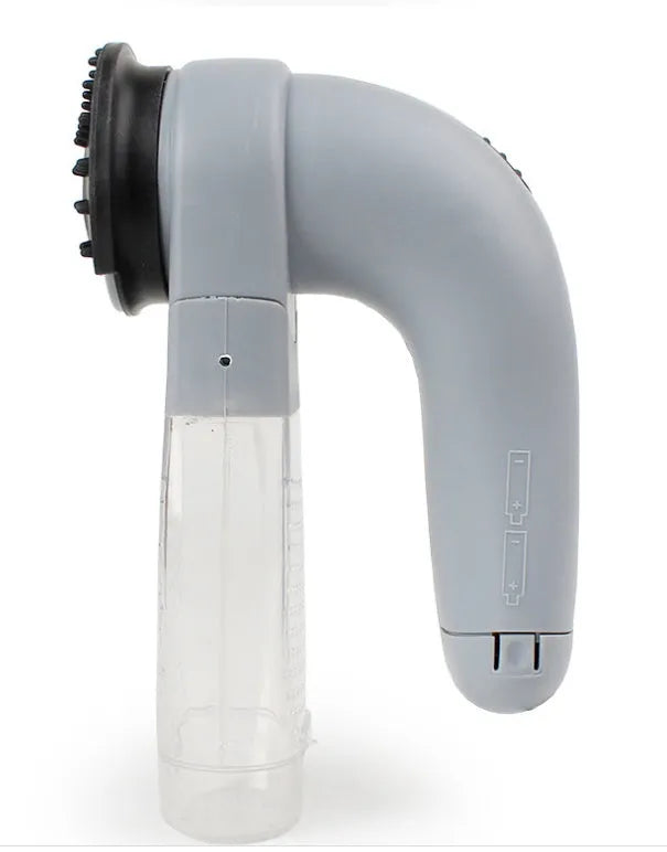 Gray portable electric pet hair remover with soft rubber head and collection canister.