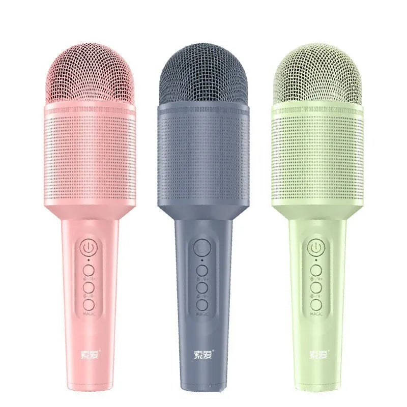 Wireless Bluetooth karaoke microphone in girly pink colour with integrated speaker grill and USB port.