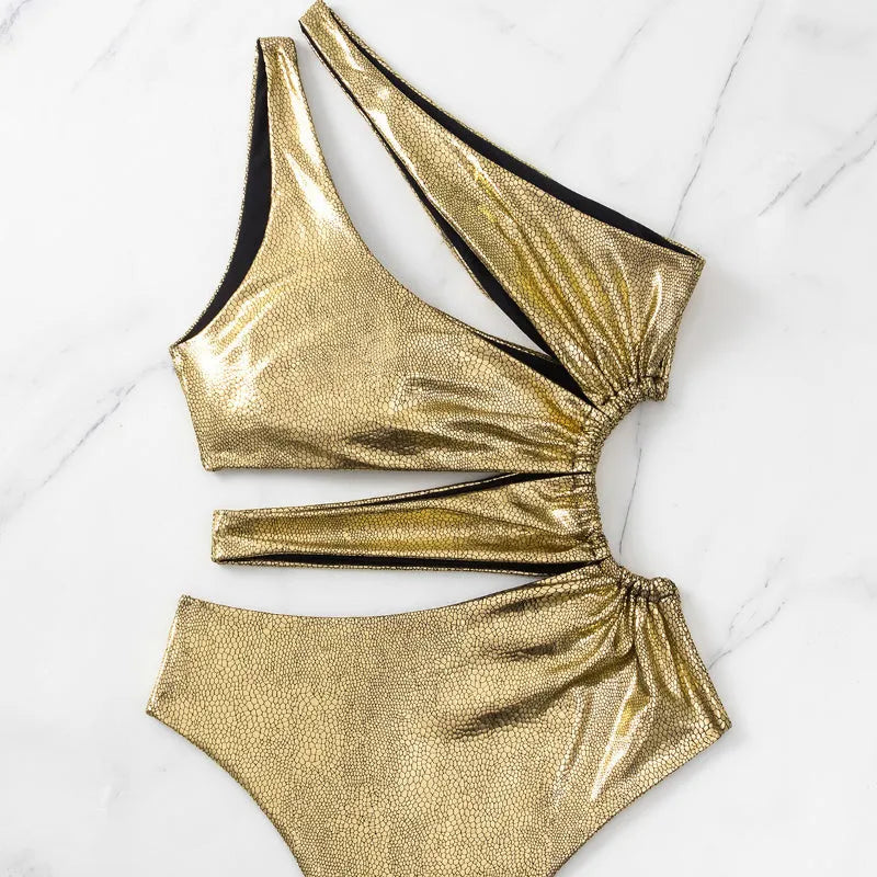 Women's gold backless one-piece swimsuit on hanger showing sleeveless design and solid colour