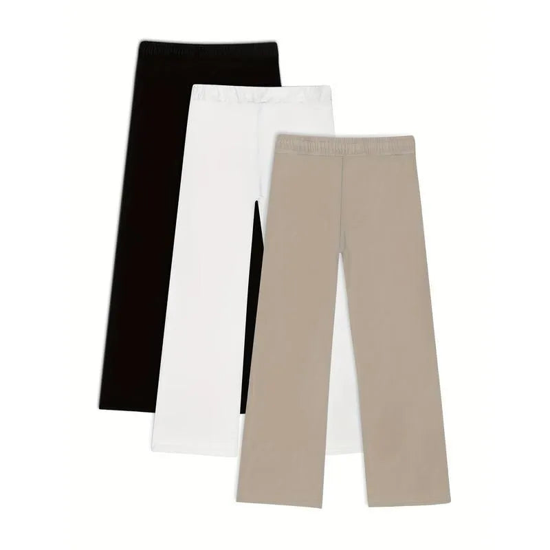Pack of three men's solid colour loose-fit corduroy trousers on a hanger.