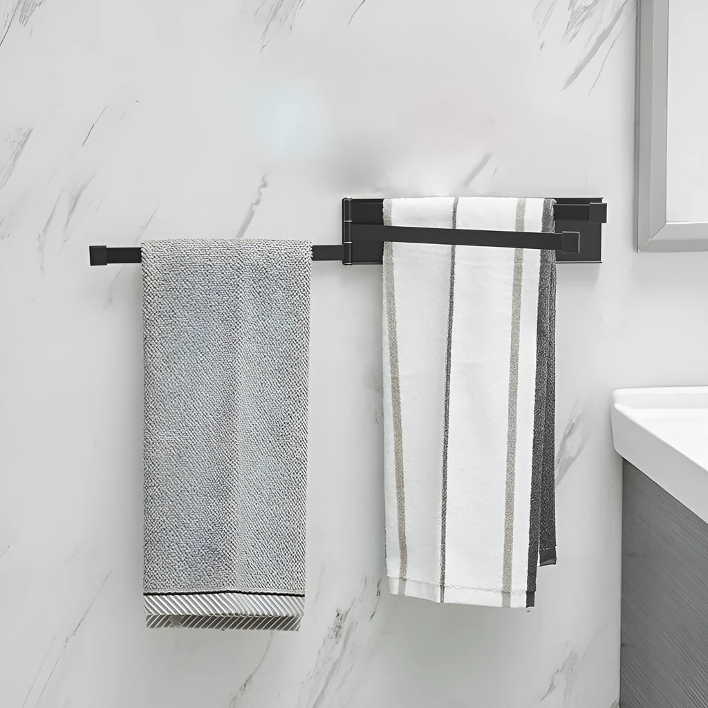 Nordic-style folding towel rack in black or white with adhesive mounting system