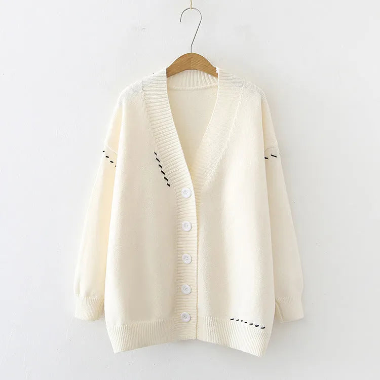 Women's loose fit knitted cardigan coat in black or white with long sleeves