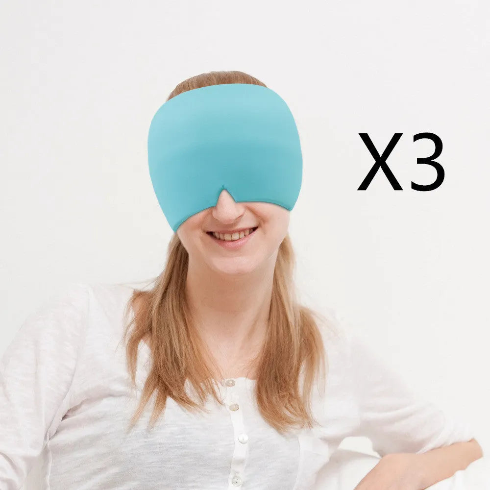 Black elastic cloth gel cold therapy eye mask for headache relief on grey background.