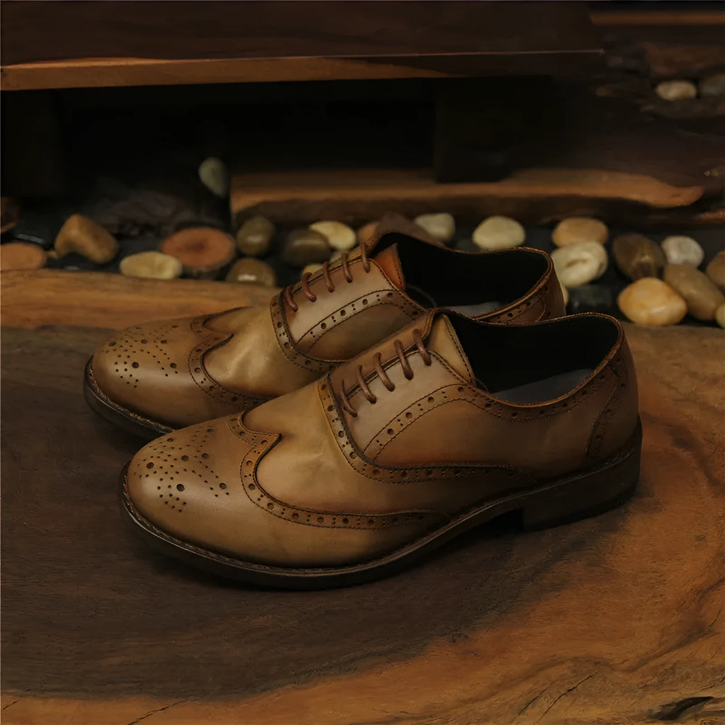 Light brown men's vintage distressed leather shoes with engraved detailing and lace-up closure