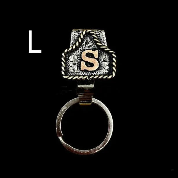 Handmade metal cow tag belt key holder keychain on a key ring, showing the metal loop and tag design.