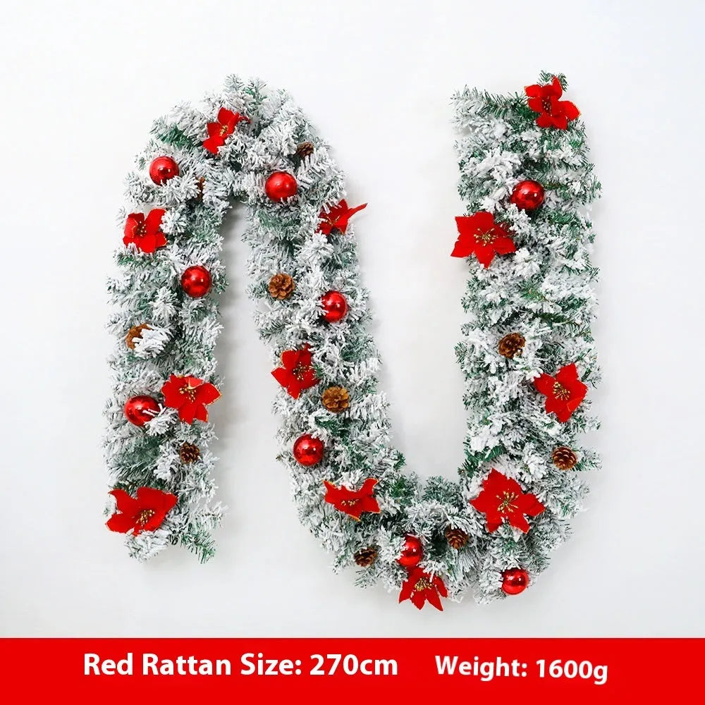 Snow-flocked Christmas rattan garland vine in red, draped on a mantelpiece.