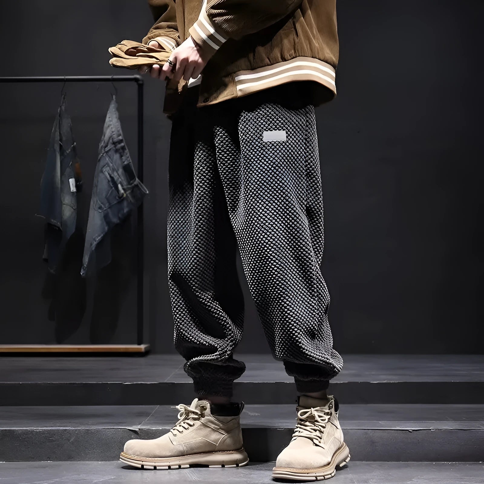 Men's grey straight-leg casual sweatpants with an ankle-tied design on a white background.