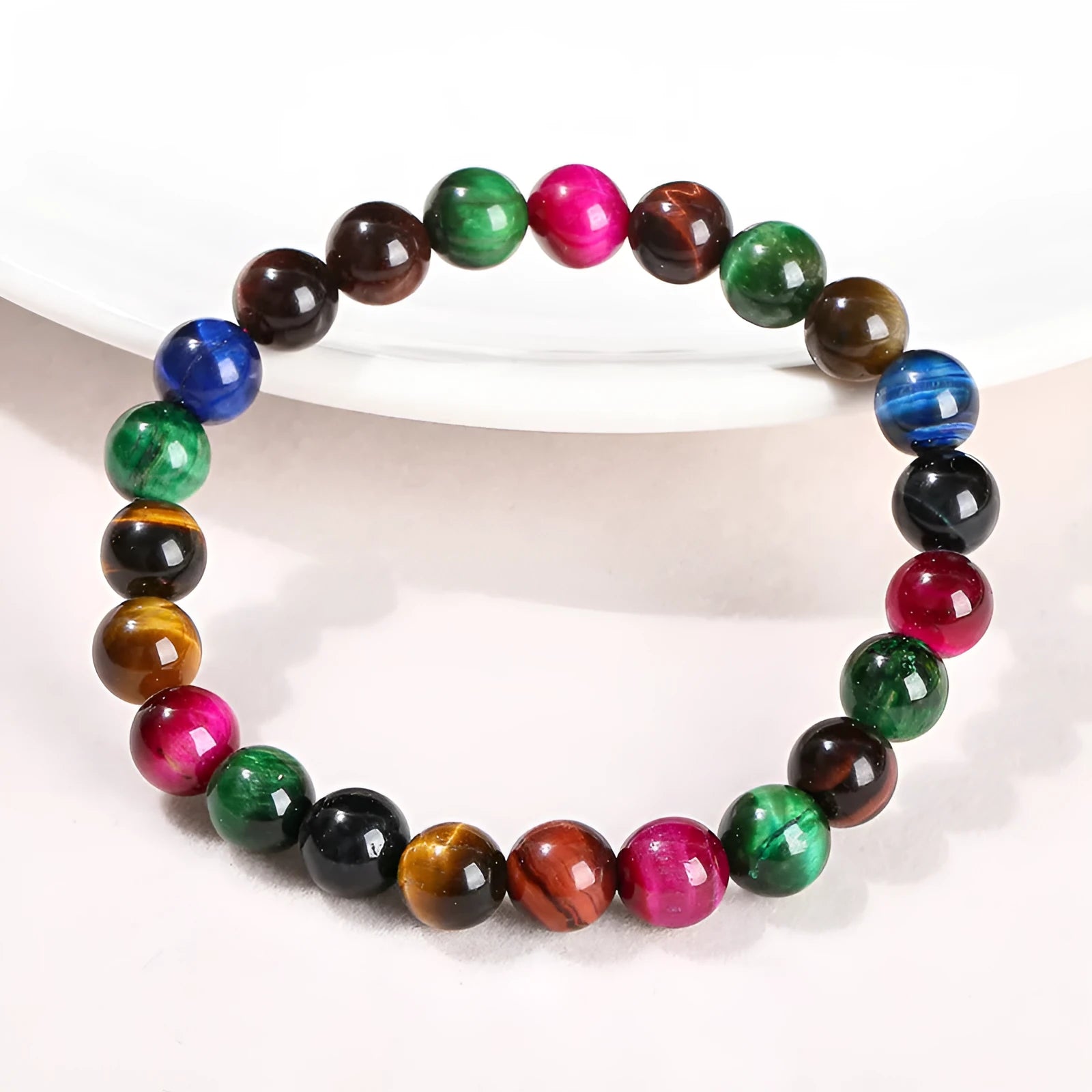 Women's colourful tiger eye stone bracelet with round beads on a string, showing size options.