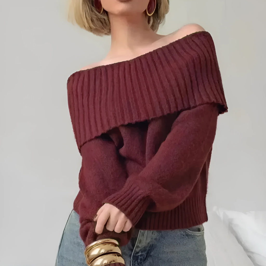 Grey off-the-shoulder sweater with a 3D textured pattern and strapless design.