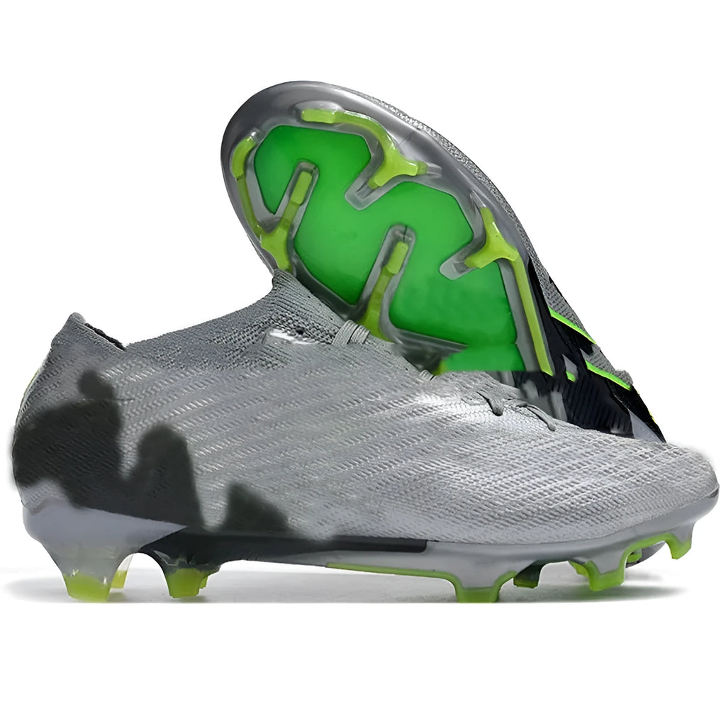 Men's black football shoes with FG studs, knitted upper, and lace-up closure on grass pitch