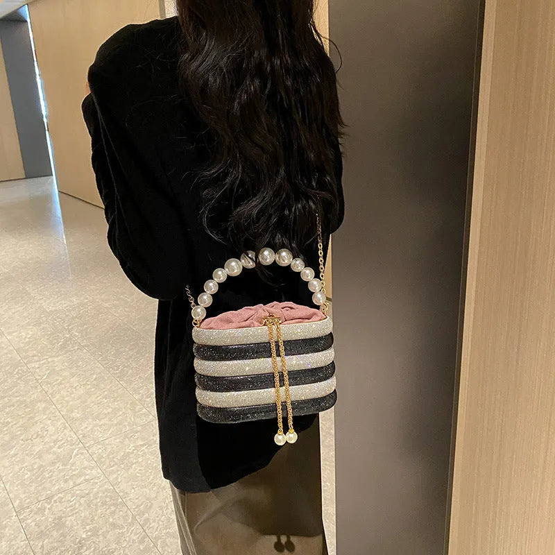 Retro style women's crossbody bag with pearl beading decoration and round shape