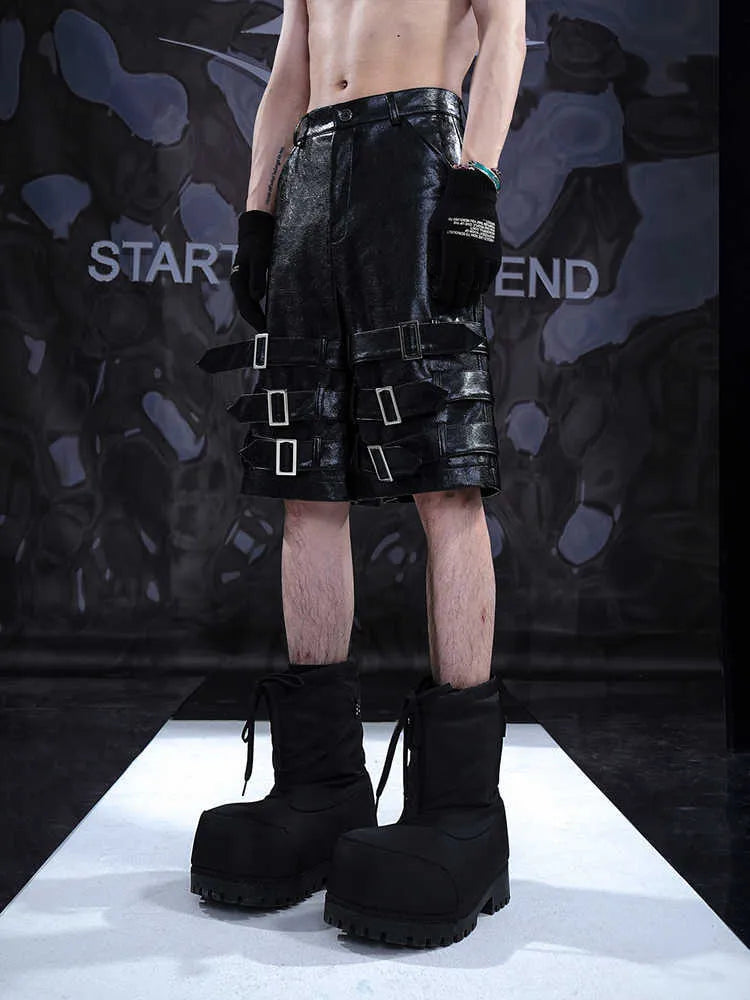 Black men's PU leather casual cropped shorts with a medium-low waist on a mannequin.