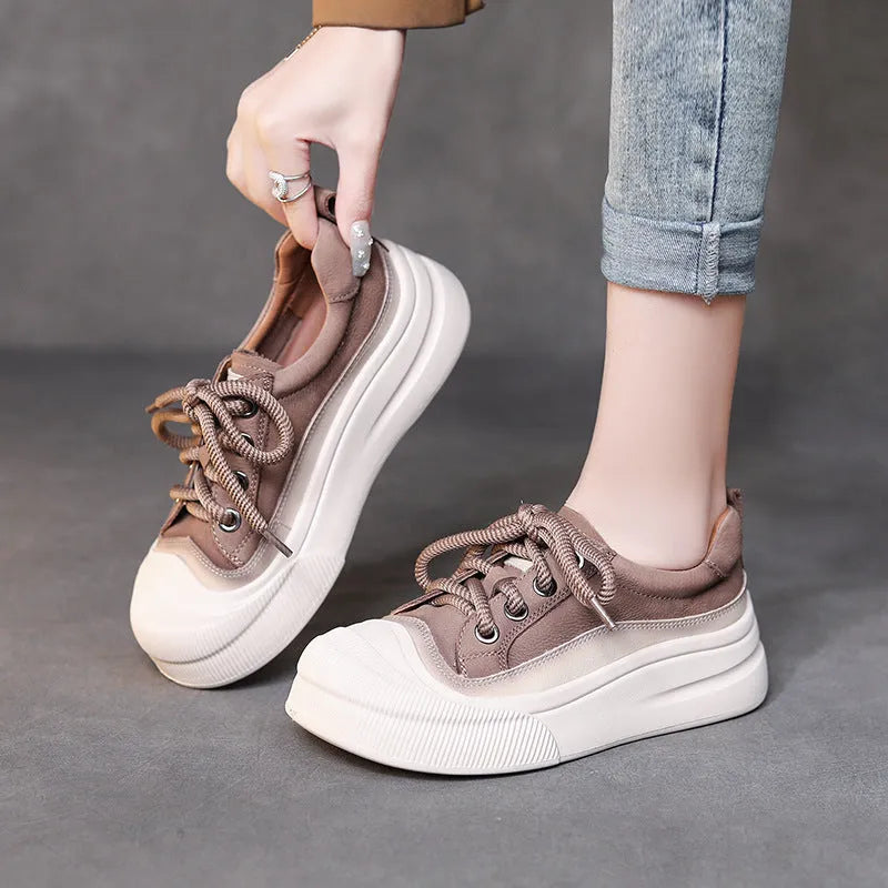 Women's yellow leather lace-up casual shoes with round toe and rubber sole.